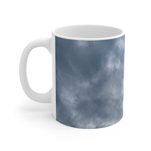 Dramatic cloud-filled sky nature photograph printed on an 11 oz white ceramic mug