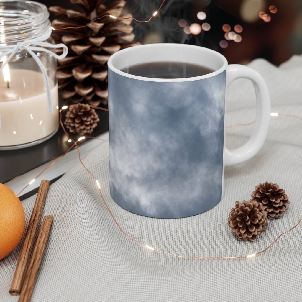 Dramatic cloud-filled sky nature photograph printed on an 11 oz white ceramic mug