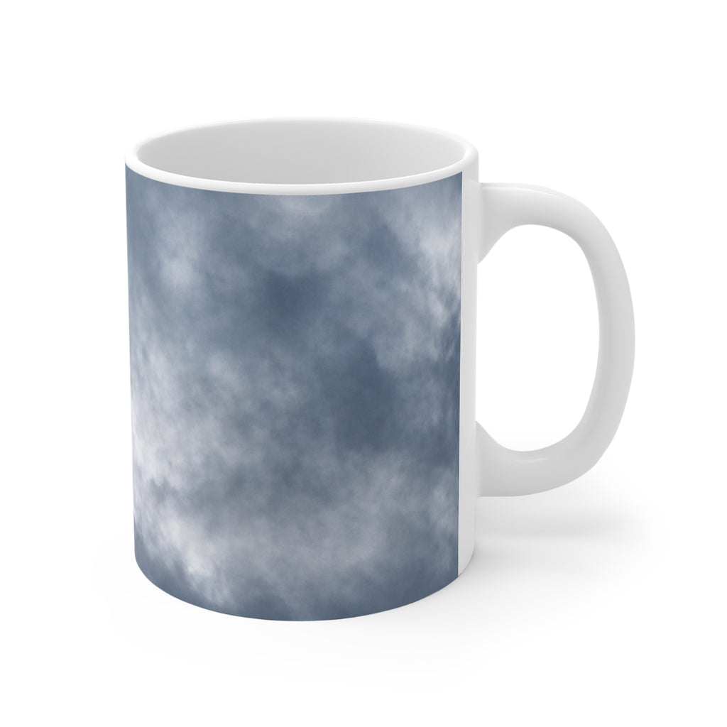 Dramatic cloud-filled sky nature photograph printed on an 11 oz white ceramic mug