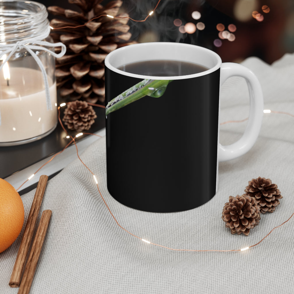 Dew-covered grass blade nature photograph printed on an 11 oz white ceramic mug
