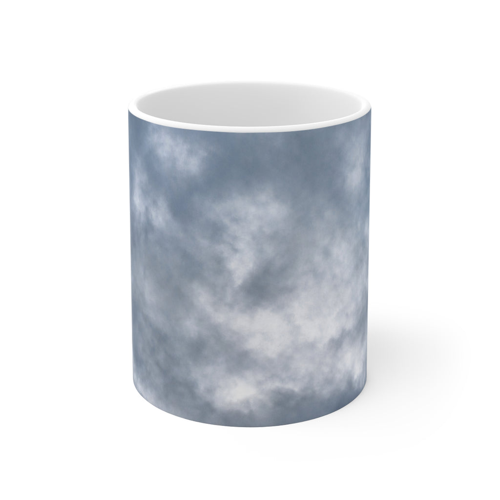 Dramatic cloud-filled sky nature photograph printed on an 11 oz white ceramic mug