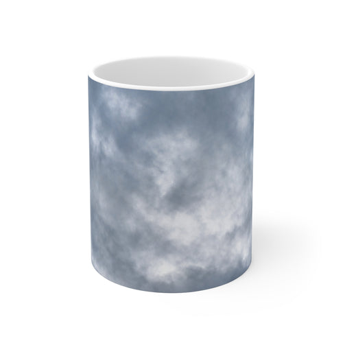 Dramatic cloud-filled sky nature photograph printed on an 11 oz white ceramic mug